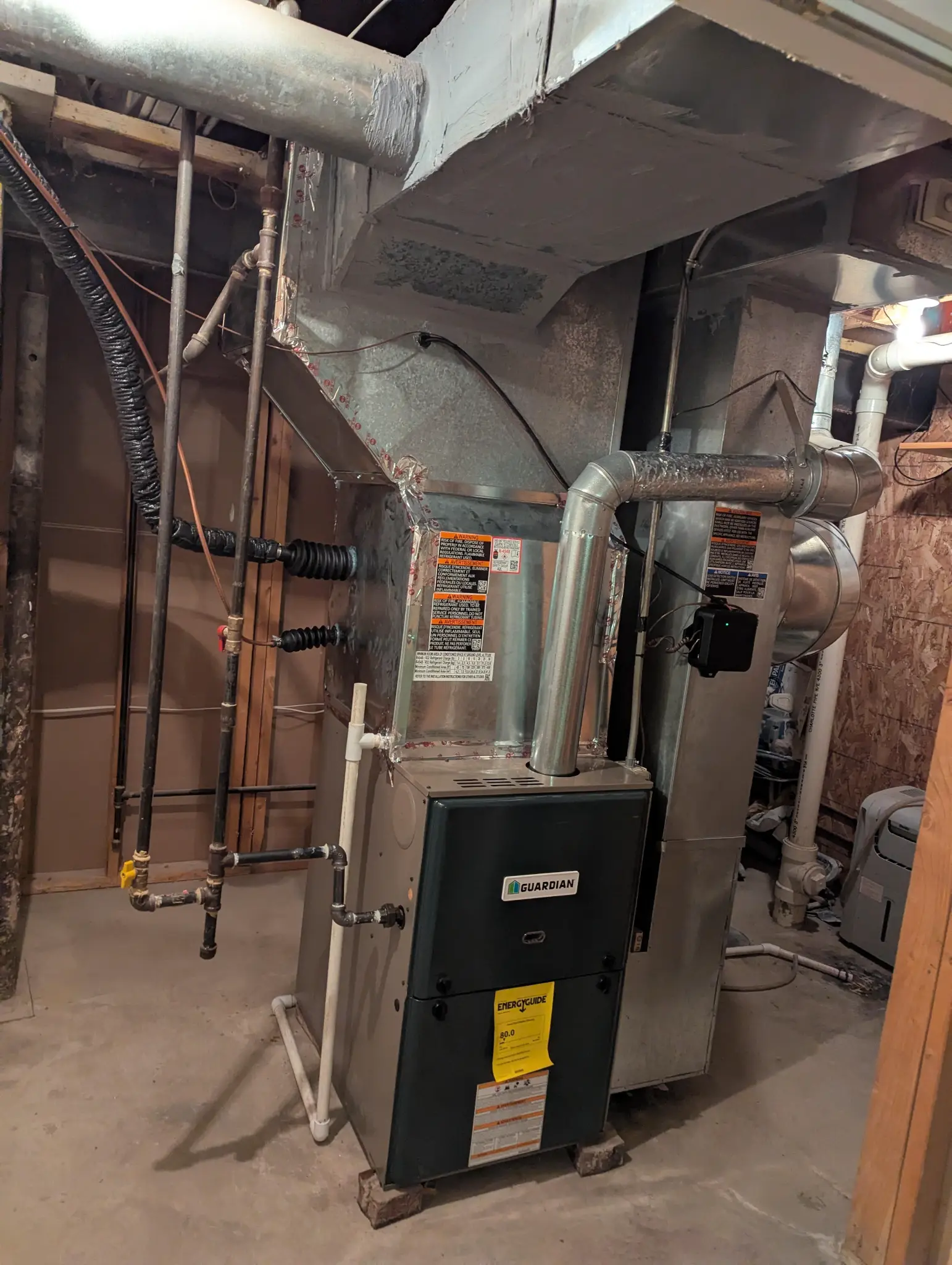 Residential furnace in a basement utility area