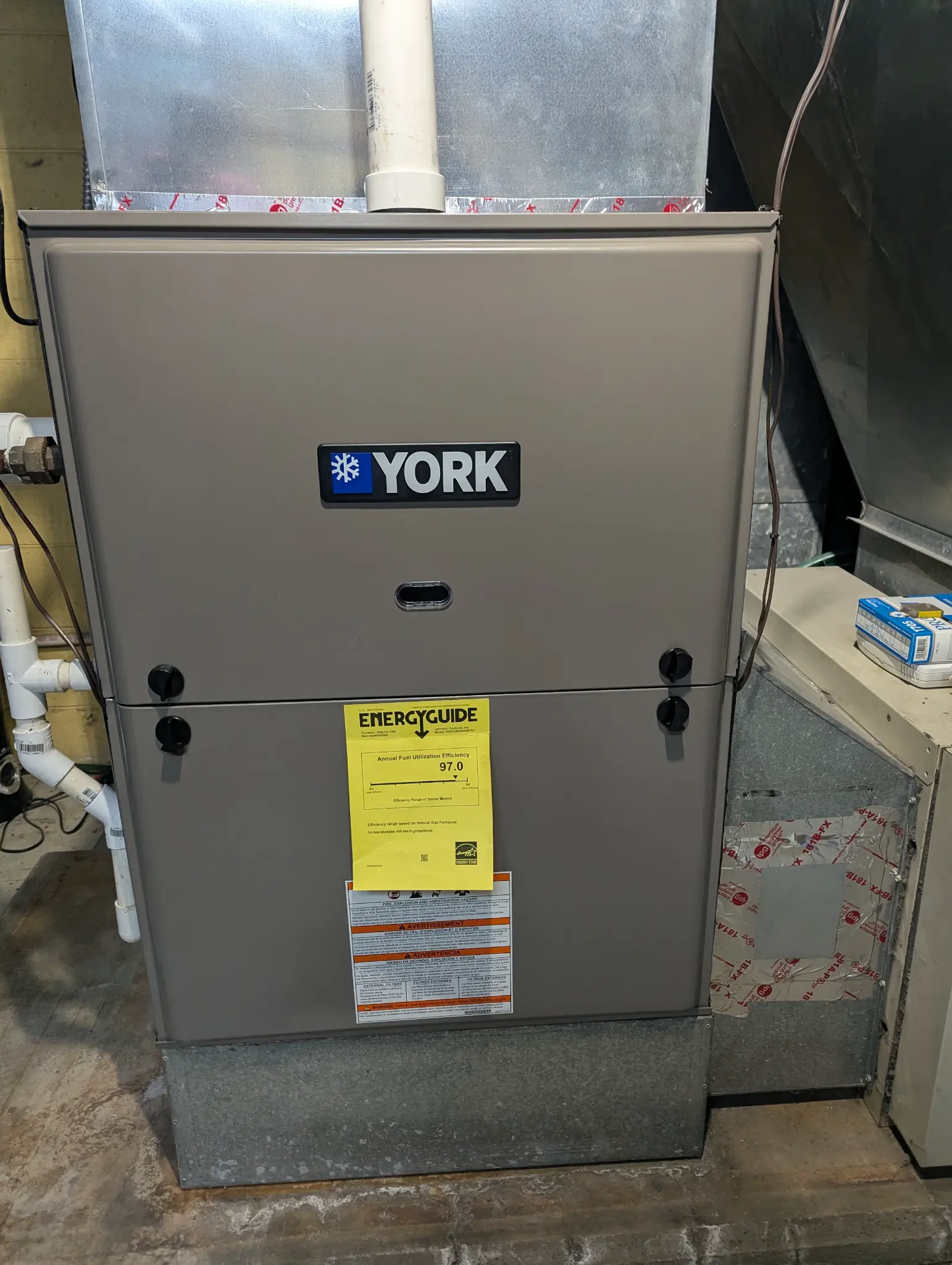 York furnace with an EnergyGuide label and connected ductwork